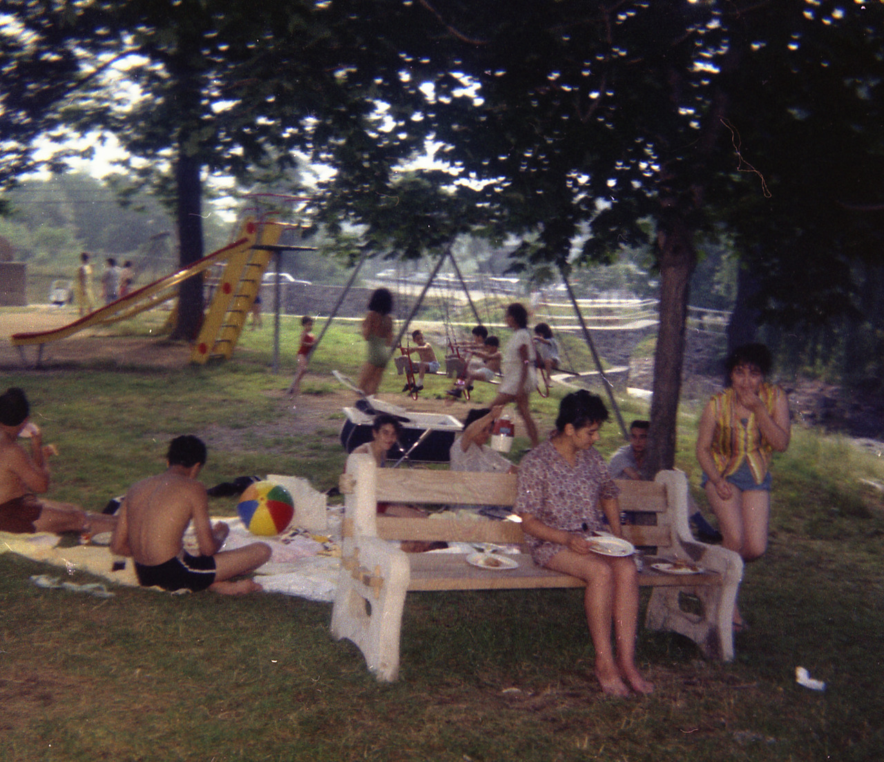 American playground around 1960. Note the happy children, swingsets and slides.