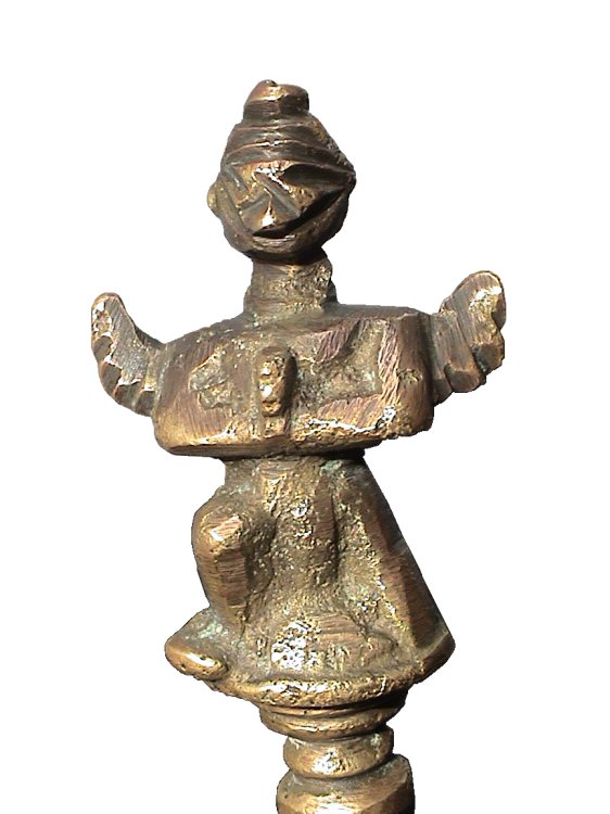 Figurine on the bell handle - front view.
