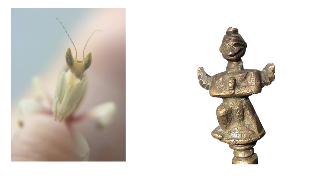 The figurine on the bell compared to an insect.