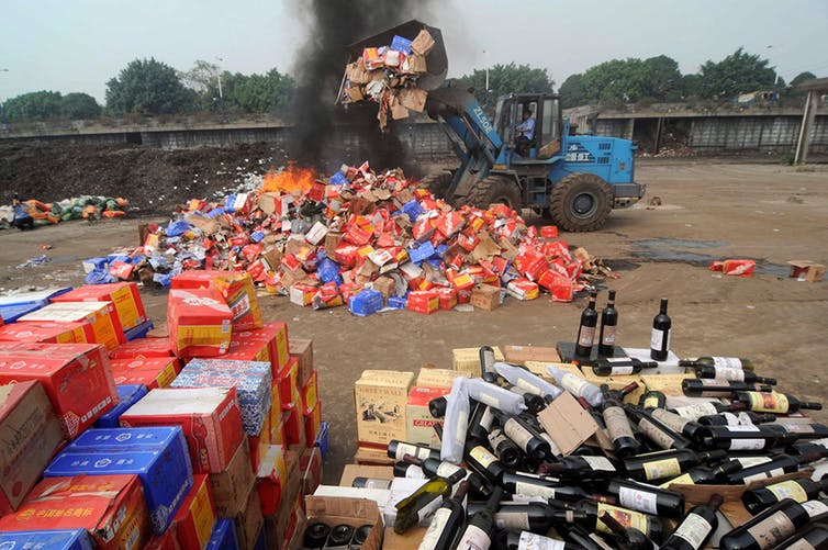 Fake wines being destroyed.