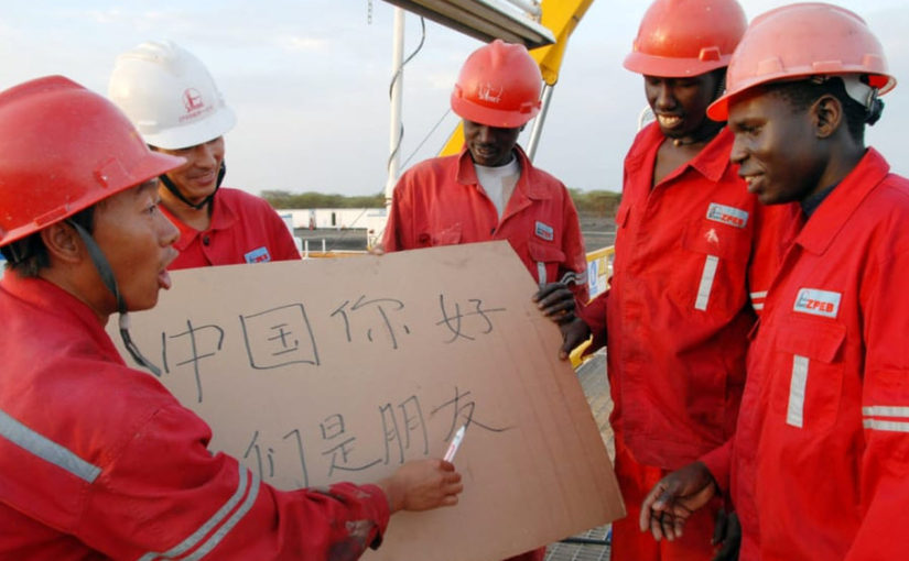 Teaching African workers how to work at Chinese factories.