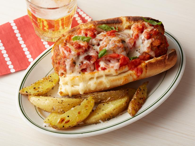Delicious meatball sandwich with beer.