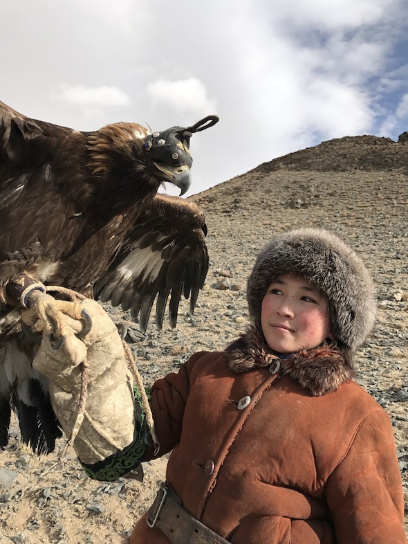Fourteen year old daughter going hunting with her eagle. Historically, the Mongolians married early and marraiges at a (now considered young age) was the norm at the time of the great Genghis Khan.