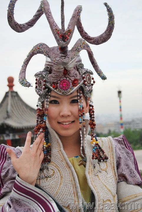 A Mongolian woman at a cultural event celebrating their traditions and history.