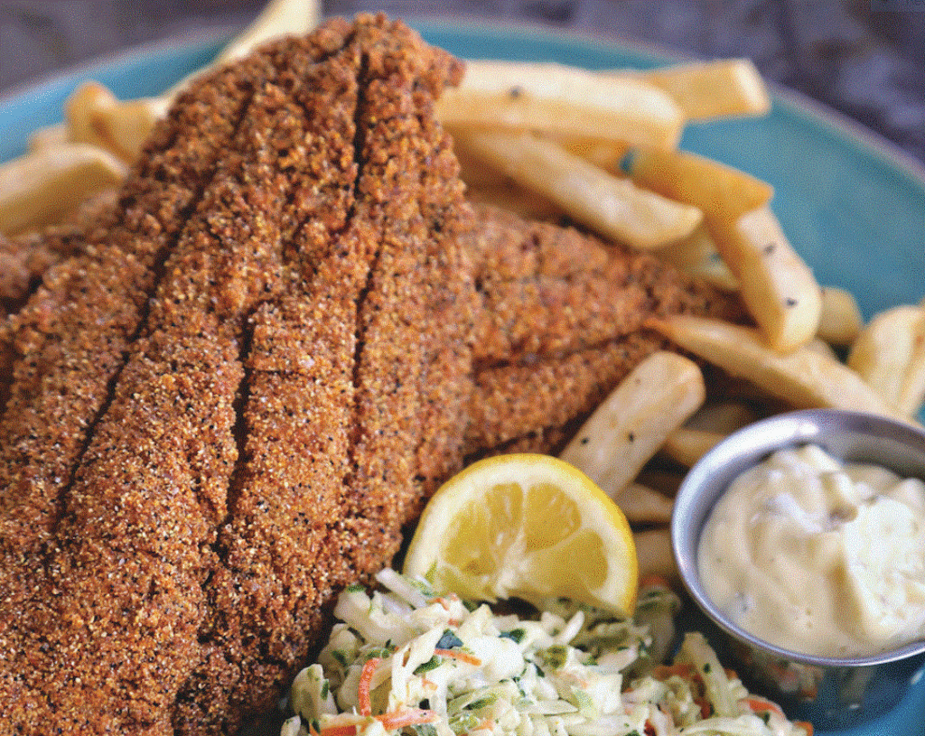 ---PHOTO---Deep fried catfish meal with a side of cole slaw and sauce.