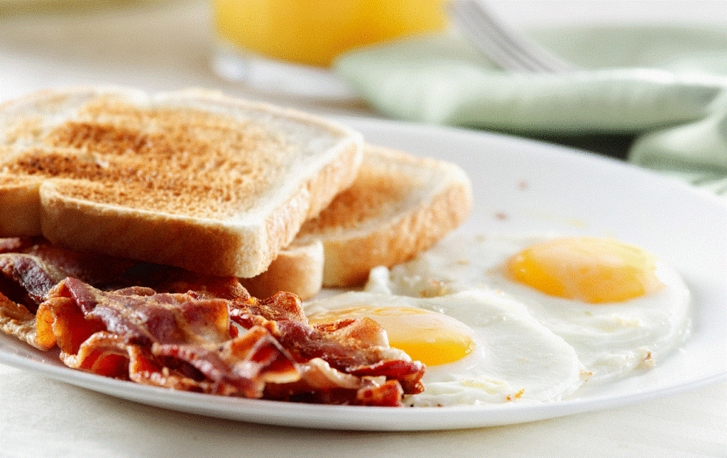 A nice bacon and eggs meal showing backon cooked properly, toast that is toasted properly and "sunny side up" eggs. Delicious!