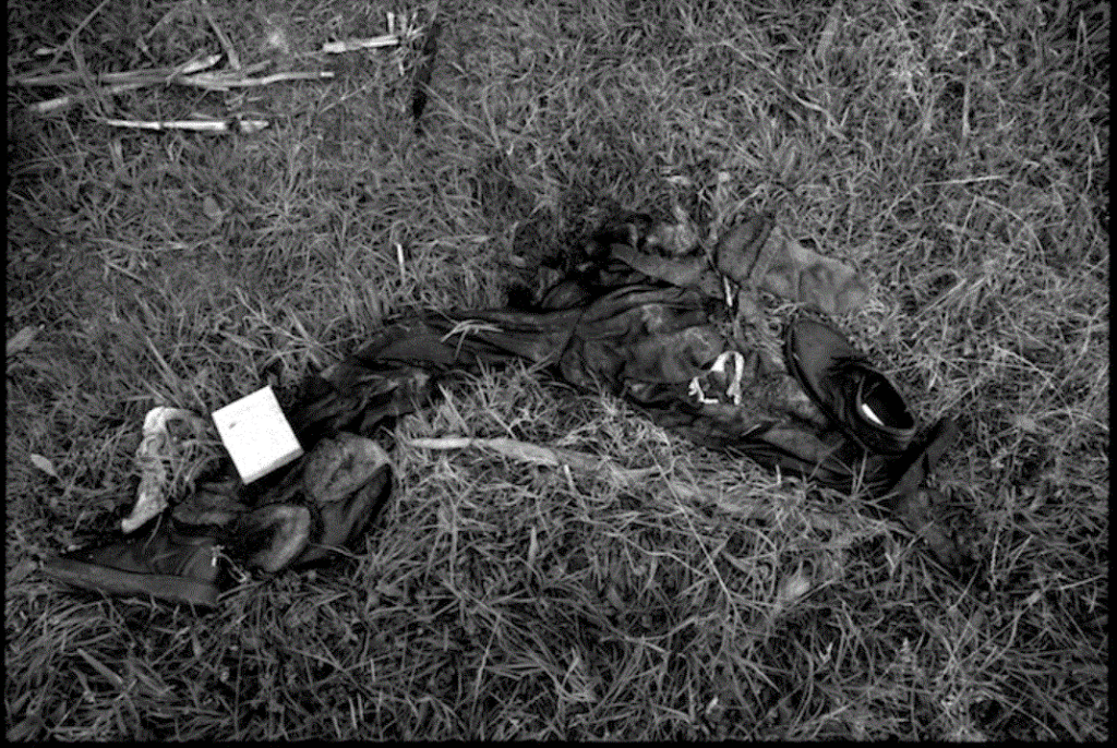 The remains of a civilian who was killed during the Bosnian conflict. Animals have scavanged most of his body. ALl that remains are his trowsers, socks and shoes.