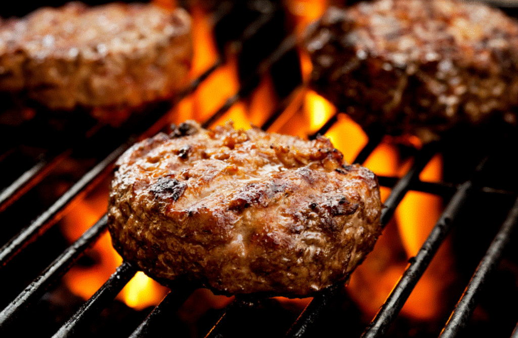 Fine delicious home-cooked and home-grilled hamburgers in the back yard is a staple of American family life.