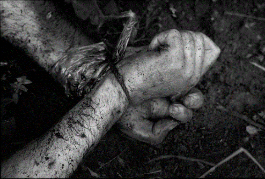 Dead civilian during the Bosnia conflict with his hands tied up. Never allow yourself to have your limbs tied up or restricted. Never permit that to happen.