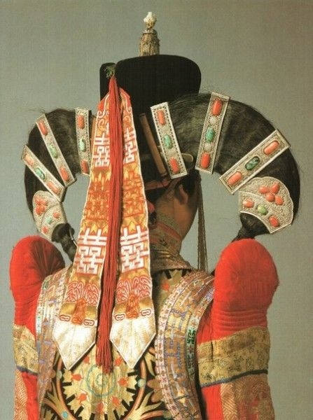 Elaborate Mongolian head attire. They wore this attire whether the weather was hot or freezing cold. They were fierce at a level that is unheard of today. That includes the strongest female characters in your contemporaneous Hollywood movies.