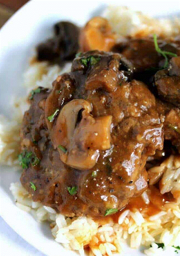 --PHOTO--Again, it might seem like this salsbury steak meal is Chinese. But no. It's not. It's as American as Football cheerleading squads and Saturday nights in the GTO. It's different in that the gravy, the meat and the way of cooking the meal differs substantially from what is present in China. That's neither good nor bad, it's jsut he way it is. Live the difference!