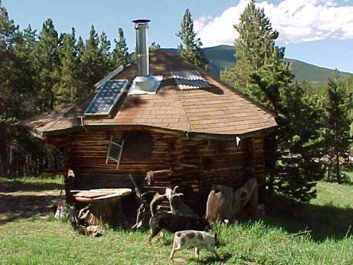 Small cabin with solar panels.