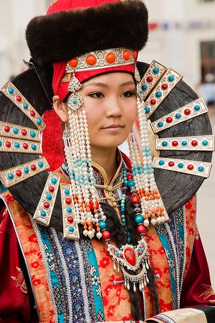 Strong and beautiful Mongolian woman in traditional clothing.