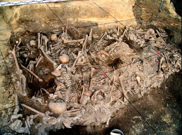 Nearly 300 bodies were buried across nine pits. The son, mother, and grandmother were buried in a pit of 15 people.