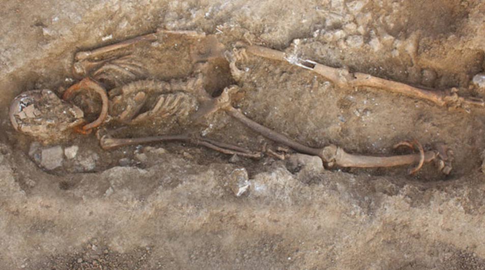 An archaeological team in France has unearthed a Gallo-Roman necropolis in Saintes, France, in which the remains of a group of adults and a child were found with iron shackles around their wrists, ankles, and/or necks. Archaeologists are trying to unravel the story of these individuals’ lives, their origin, and the circumstances of their death. 