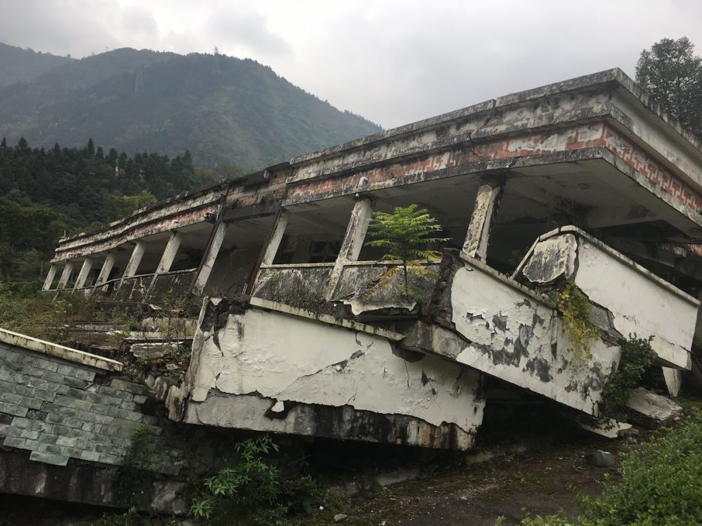 Wreckage  from the 8.0 earthquake. This is not unrepaired devastation but,  weirdly, is kept as a tourist attraction and actually propped up so it  won’t collapse further. 