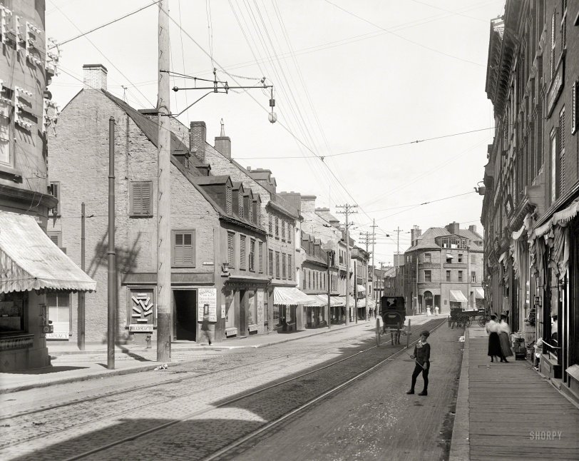 Circa 1905. "St. John Street, Quebec." Rue Saint-Jean at Côte du Palais in Quebec City, home to the drugstores of P. Mathie and J.E. Livernois. 8x10 inch dry plate glass negative, Detroit Photographic Company. 