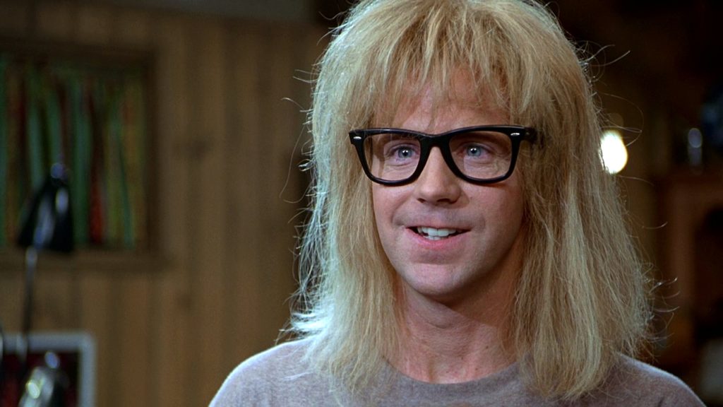  Wayne's World, in the film's plot, is the name of a Cable Access television show (dare I say "DIY") hosted by Wayne Campbell and Garth Algar. Rob Lowe plays Benjamin, an advertising scout/producer who is looking for talent to promote a chain of video game arcade stores. He finds his muse in the low-brow witticism, promptly signs the boys, and sets them up in a proper television studio.