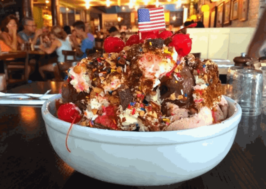 A well done ice cream sundae would have multiple scoops of real ice cream, with all sorts of toppings added.