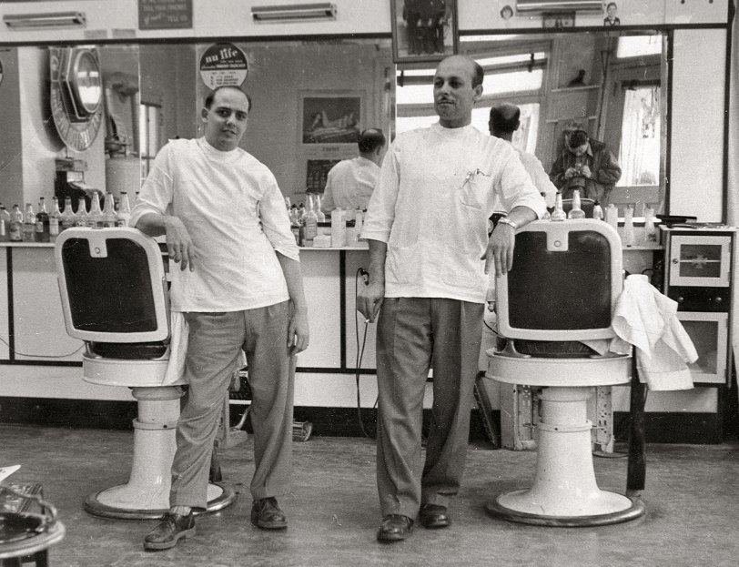 From Shorpy; "Dad ran a barbershop at our house. Two chairs and no appointment needed. I remember one customer who paid for his cuts in produce from his little farm.

Dad's partner in the shop ate dinner with us every night because he lived too far away to travel home to his wife and kids in time to eat.

And; we burned the hair that accumulated on the shop floor because back then, there was no trash service in rural communities. I can tell you the neighbors always knew when the hair was burning."