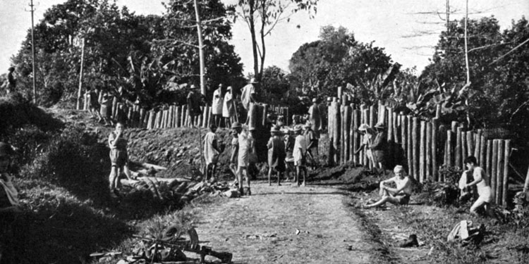 As operations to secure Madagascar continue in November 1942, British soldiers dismantle a roadblock that has been erected to impede their overland progress.
