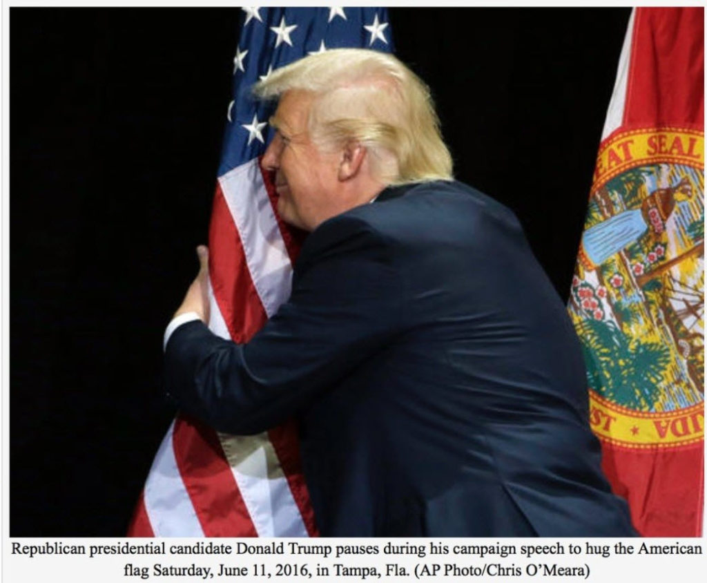 Donald Trump hugging the flag.