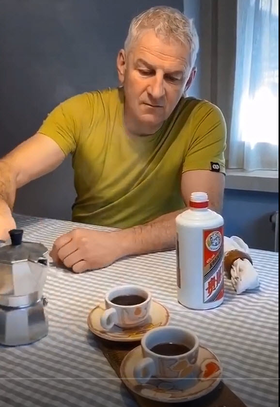 A video of a man drinking coffee.