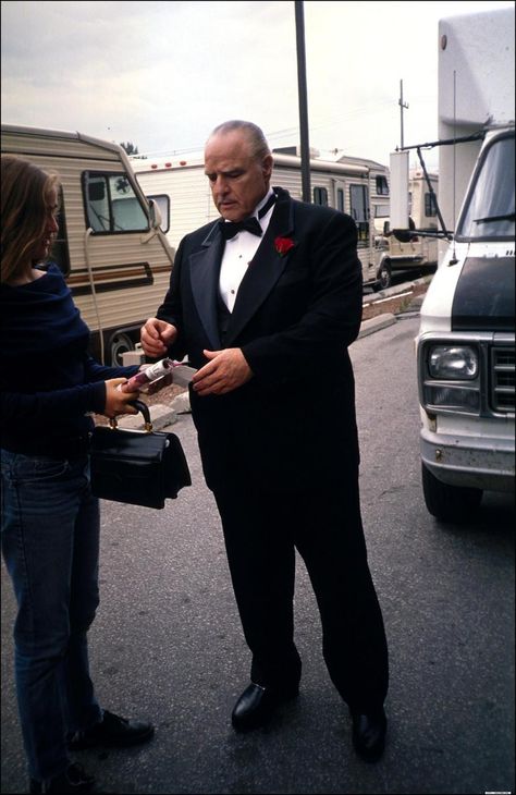 Marlon Brando wearing smoking jacket.